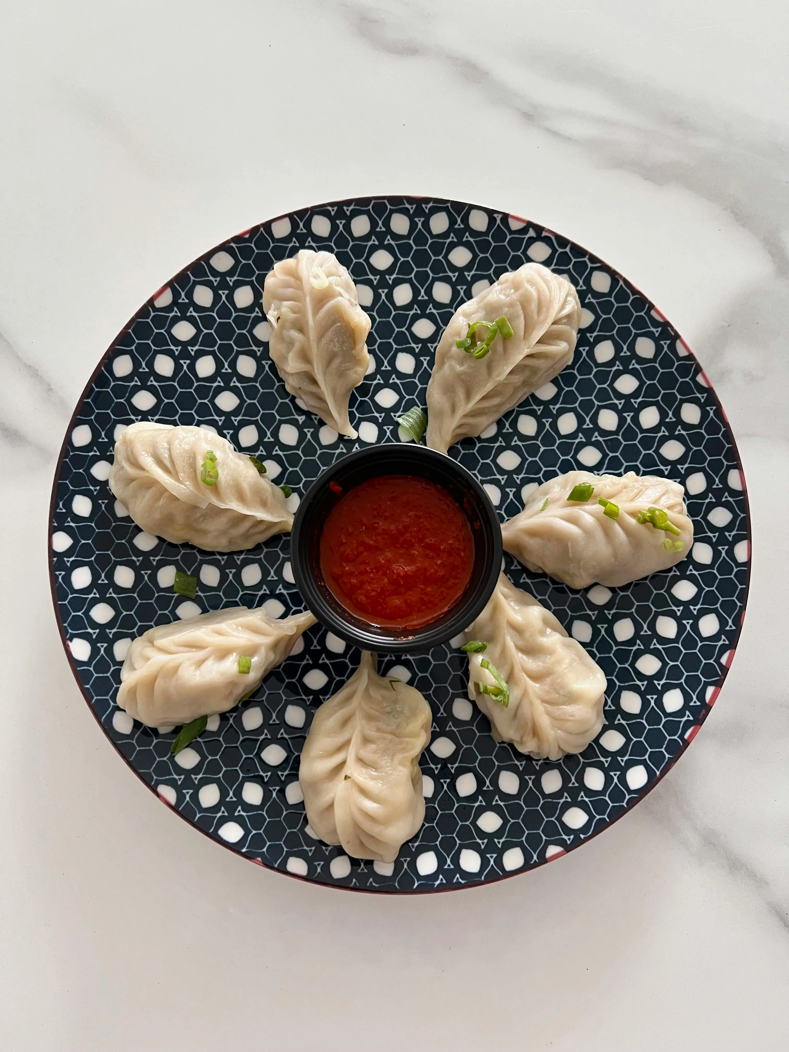 Steamed Veg Momos at Desi Club Indian Street Food & Sweets in Edmonton